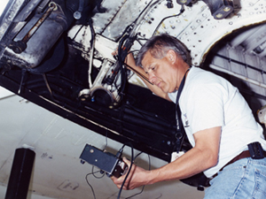 Dryden flight technician De Garcia tests equipment performance on the Super Guppy.